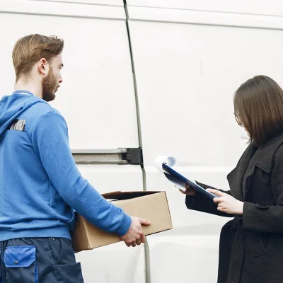 blog-thumbnail-2-man-by-truck-guy-delivery-uniform-delivery-man-with-package-outdoors