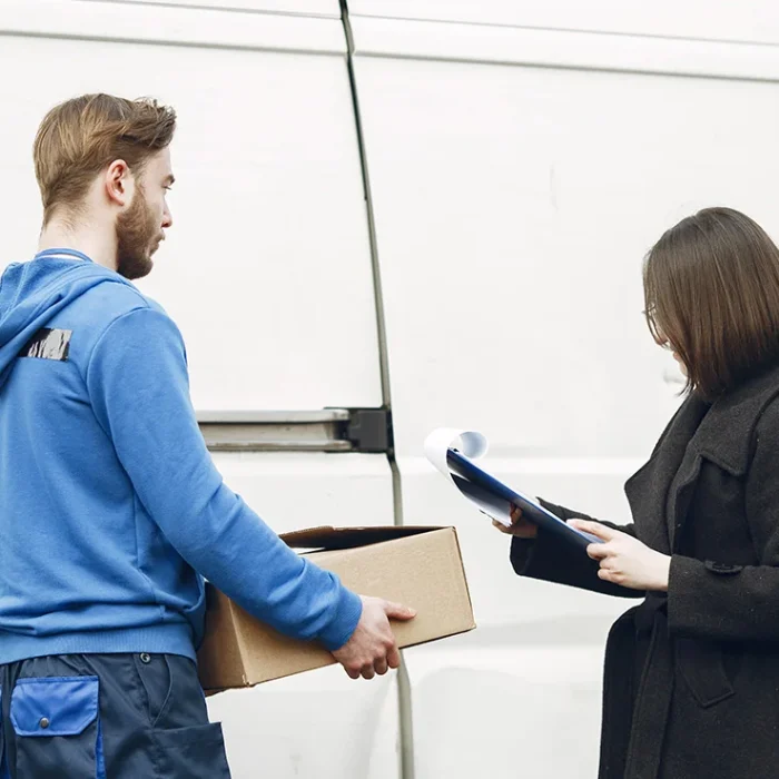 blog-thumbnail-2-man-by-truck-guy-delivery-uniform-delivery-man-with-package-outdoors